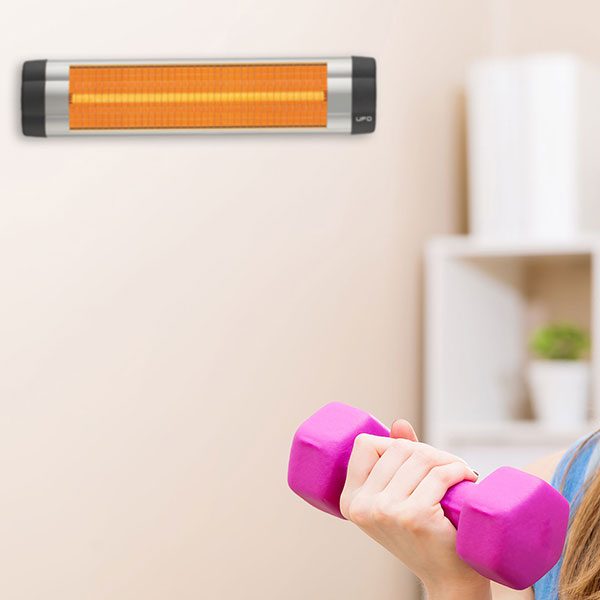 Basement workout room warmed by infrared space heater