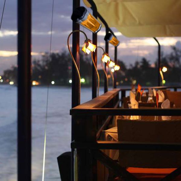 Breezy dockside dining area kept warm using infrared space heaters